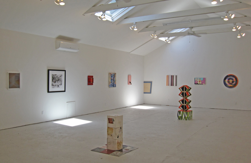 installation view of 9 paintings and wall pieces, with 2 sculptures, from Territory exhibition